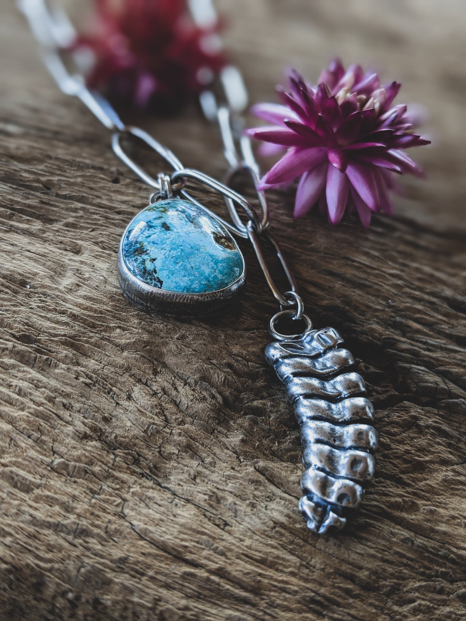 Sterling Silver necklace with handmade chain featuring rattle snake rattle and a gorgeous piece of turquoise.