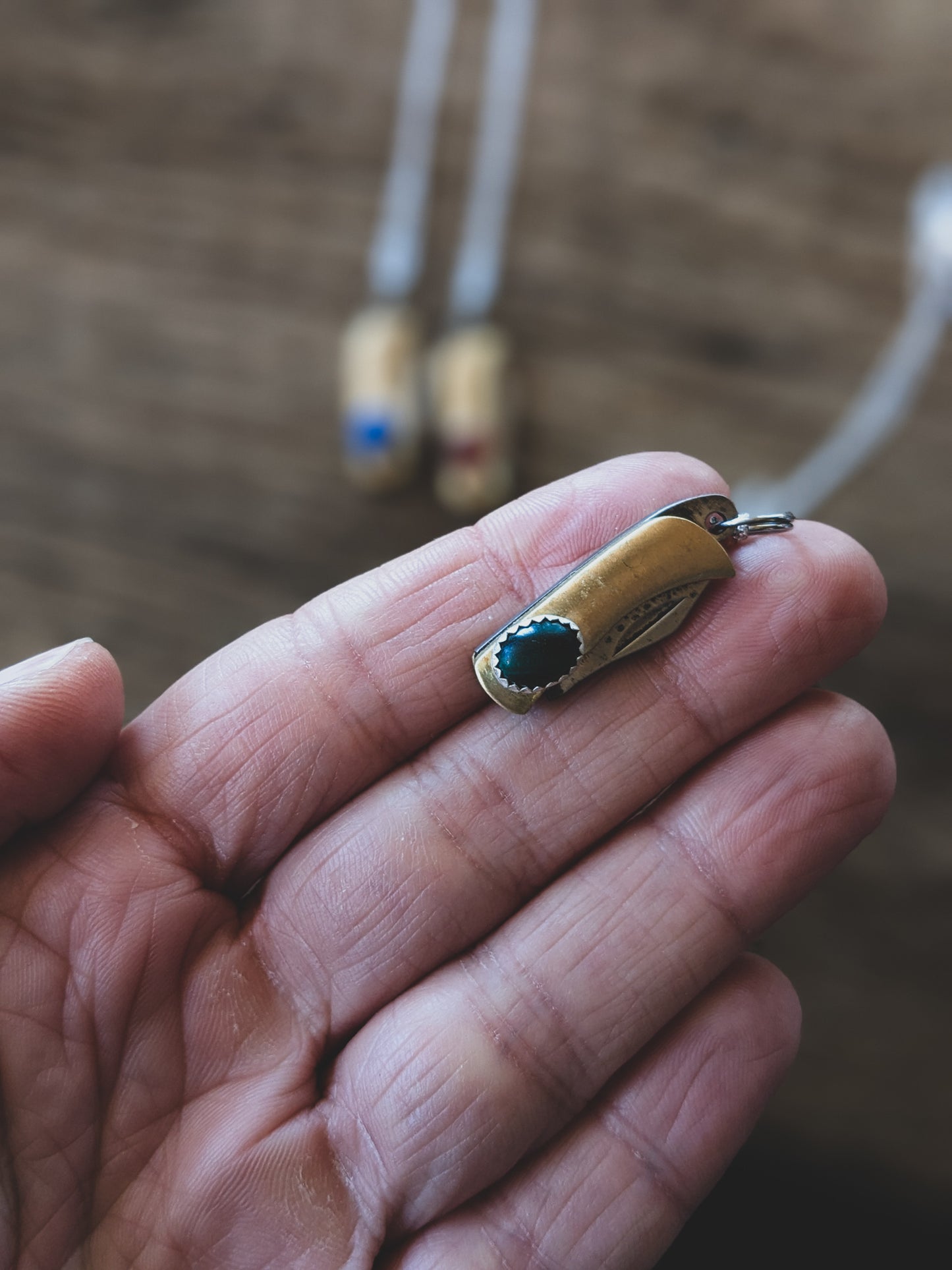tiny pocket knife resting on a finger