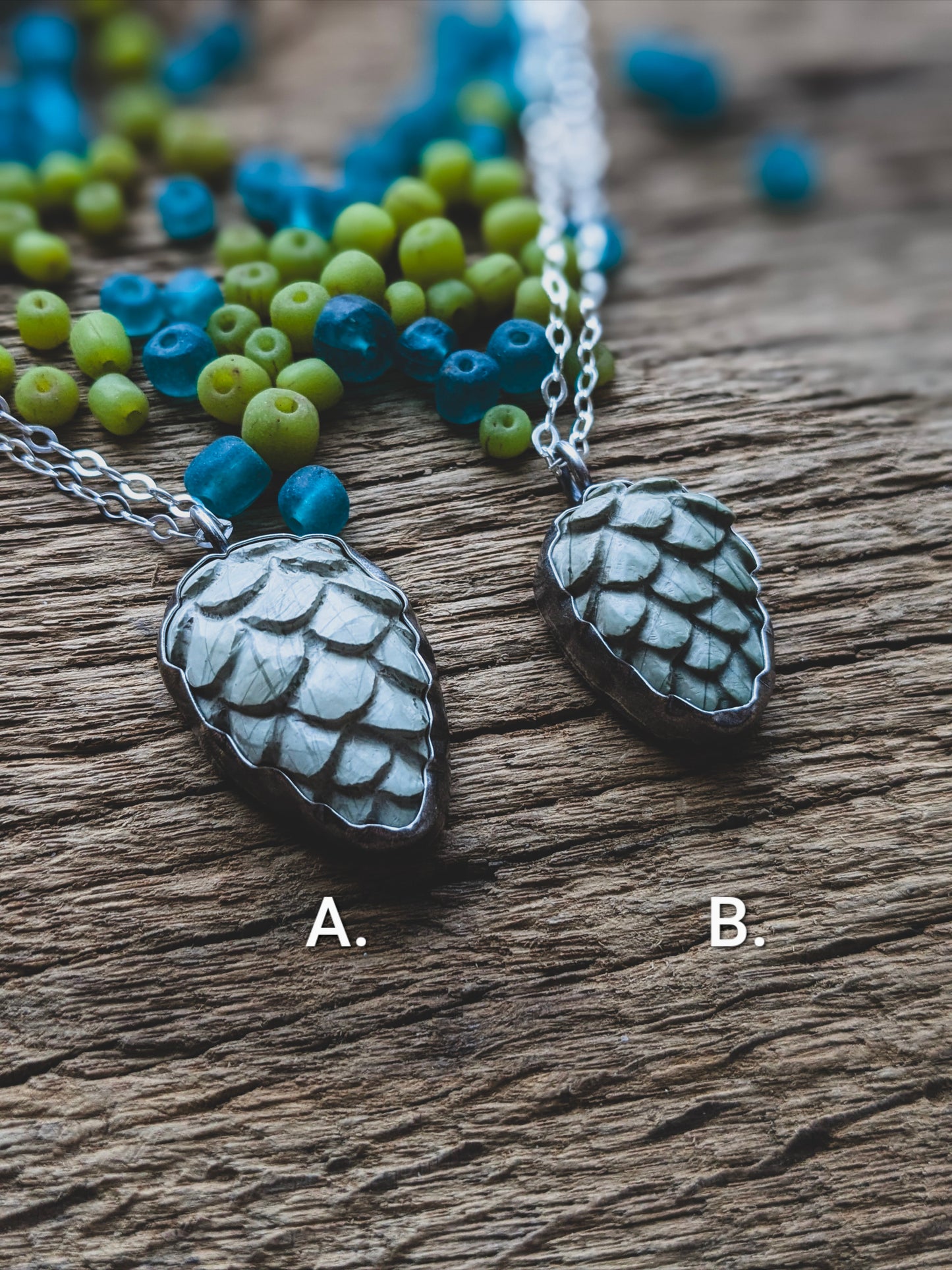 carved stone pinecone set in sterling silver